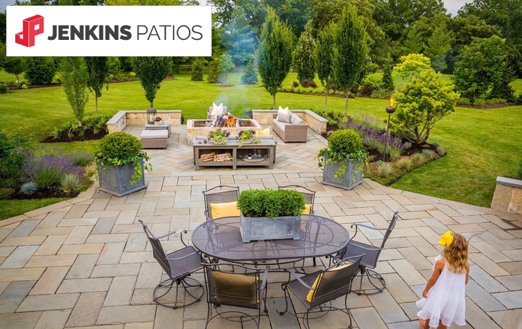 Modern small outdoor patio featuring a decorative table and seating area